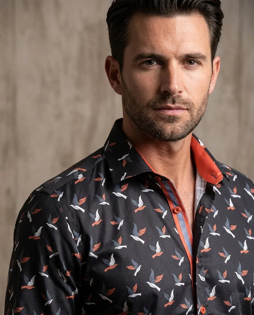 Man wearing a patterned shirt with a neutral background