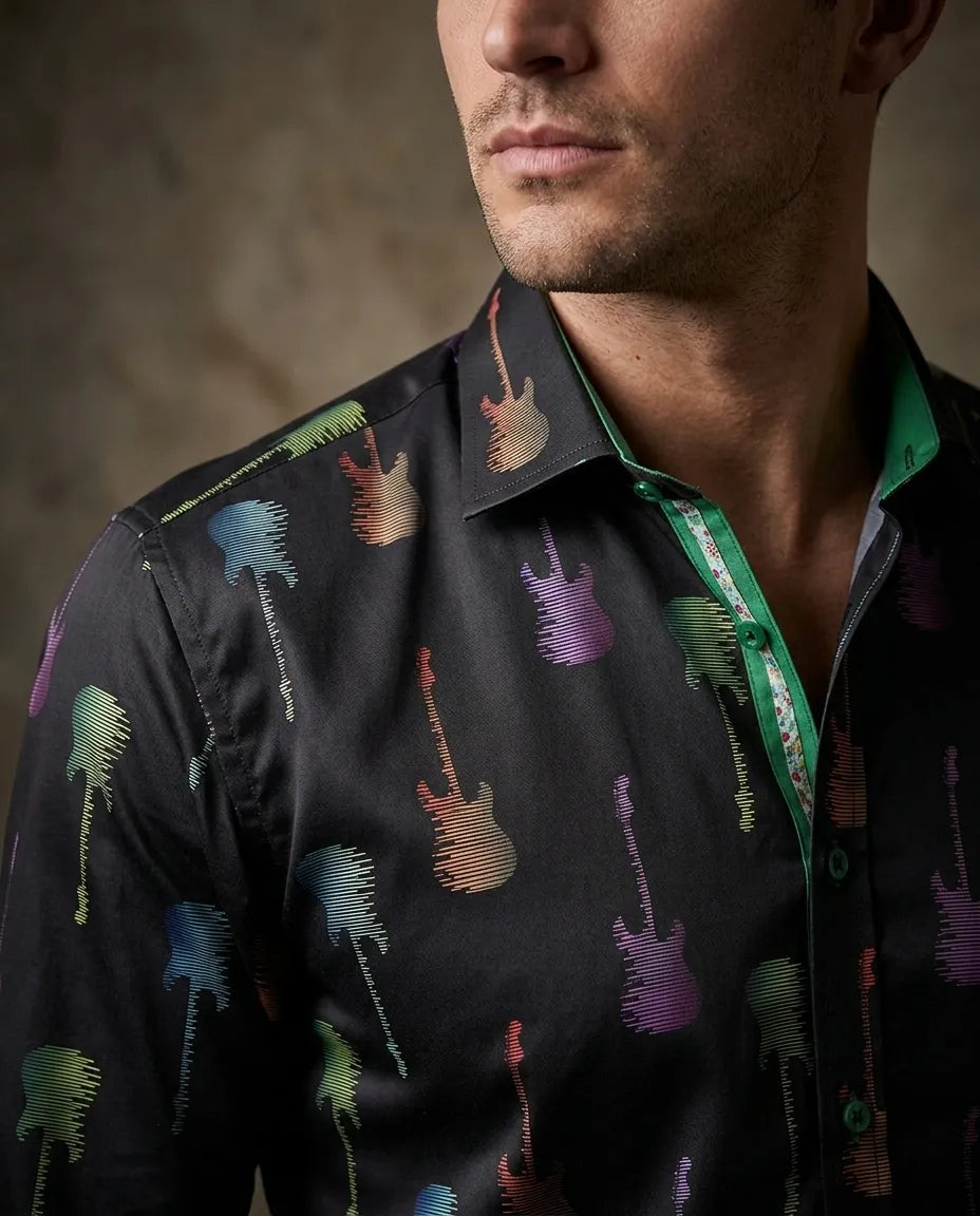 Man wearing a black shirt with colorful guitar pattern against a neutral background