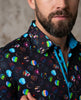 Man wearing a colorful patterned shirt with a blurred background